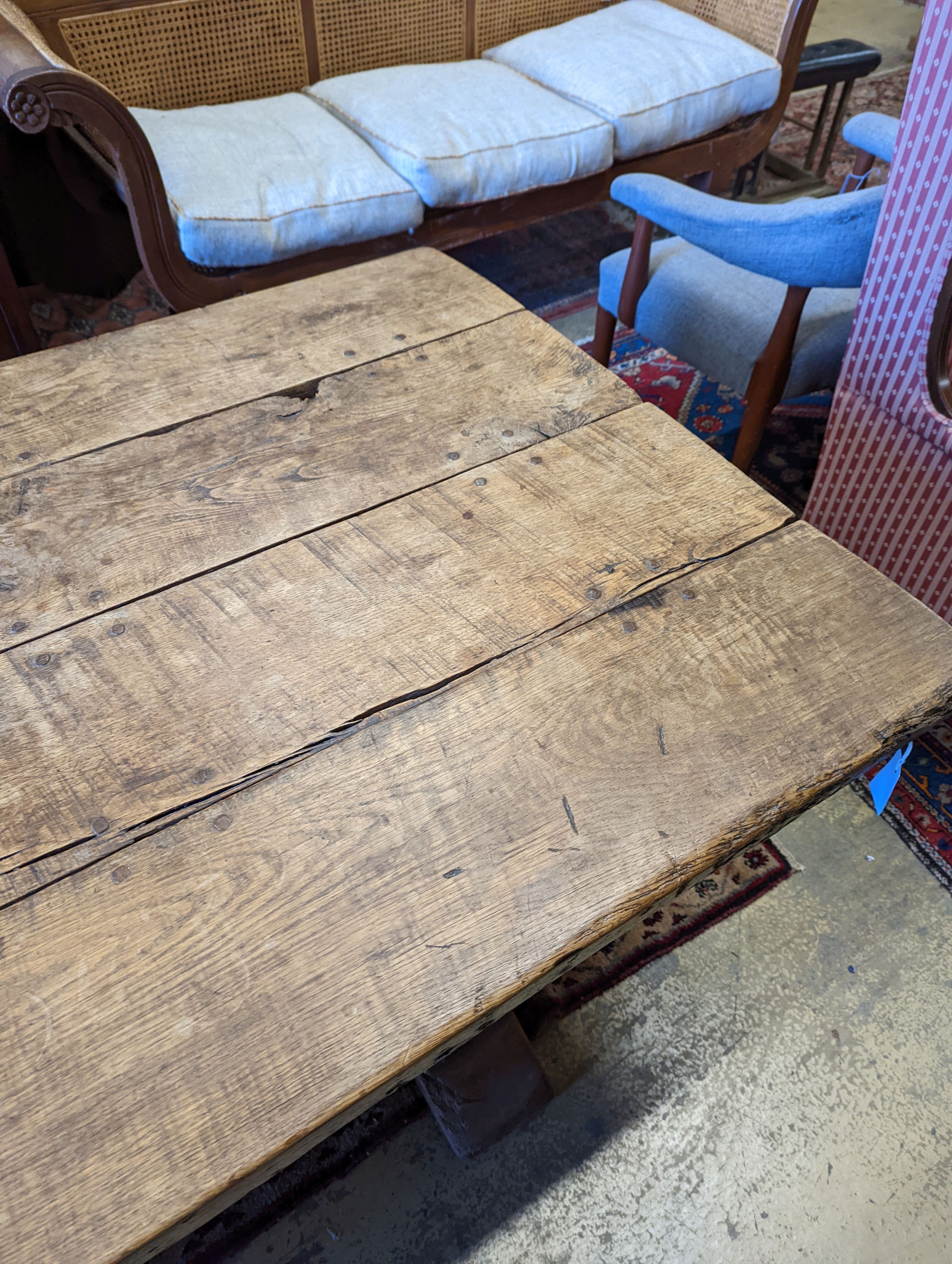 An 18th century style oak refectory dining table with planked top, length 228cm, depth 96cm, height 74cm